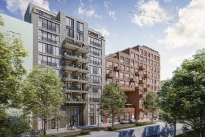 Moderne appartementencomplexen met balkons en bomen.
