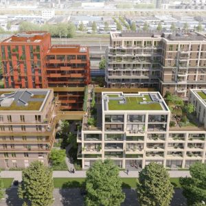 Moderne appartementencomplexen met groene daken en bomen.